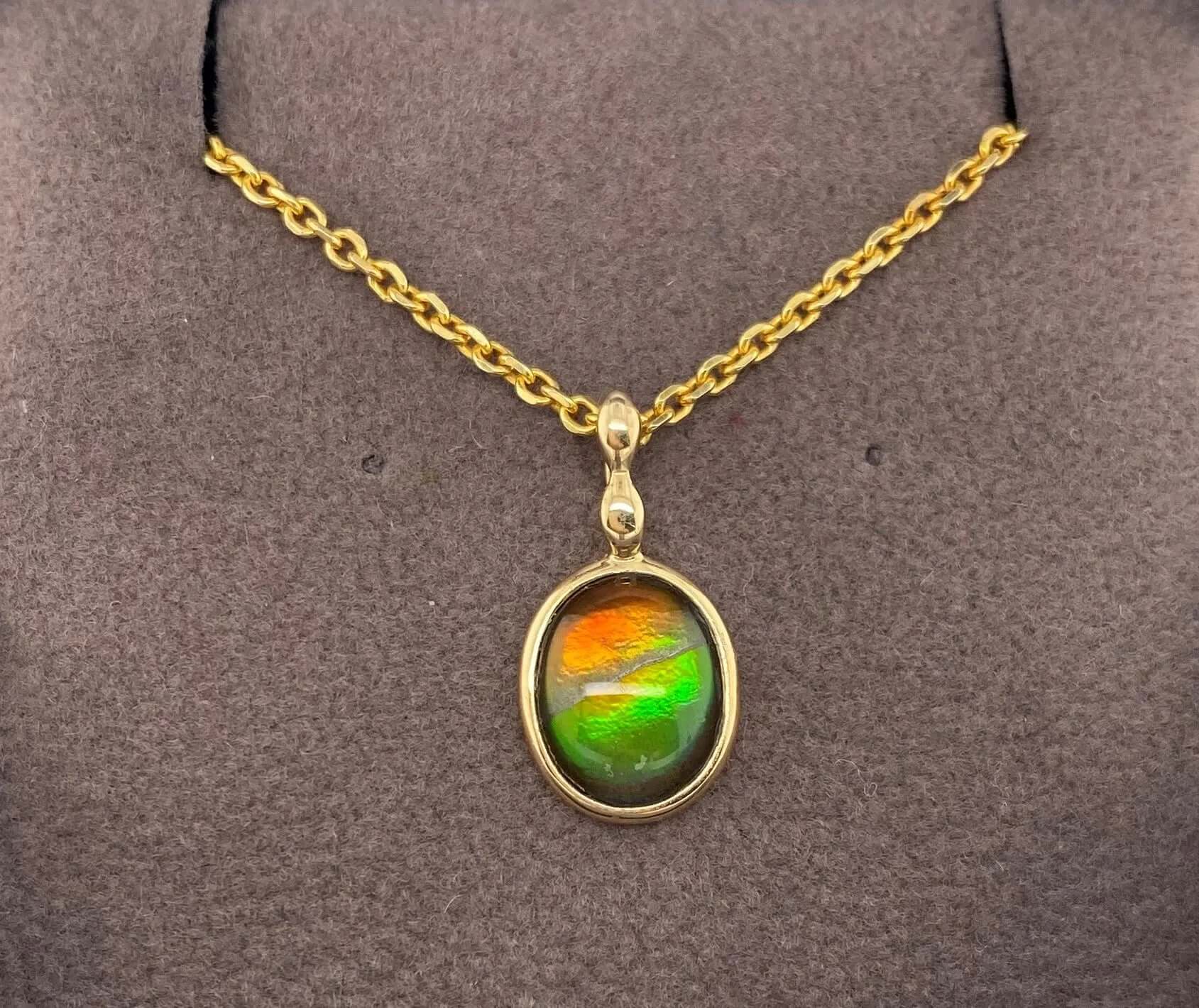 Ammolite Gold Oval Pendant with 8x10mm Gemstone PN E1361T %product from Empire Ammolite