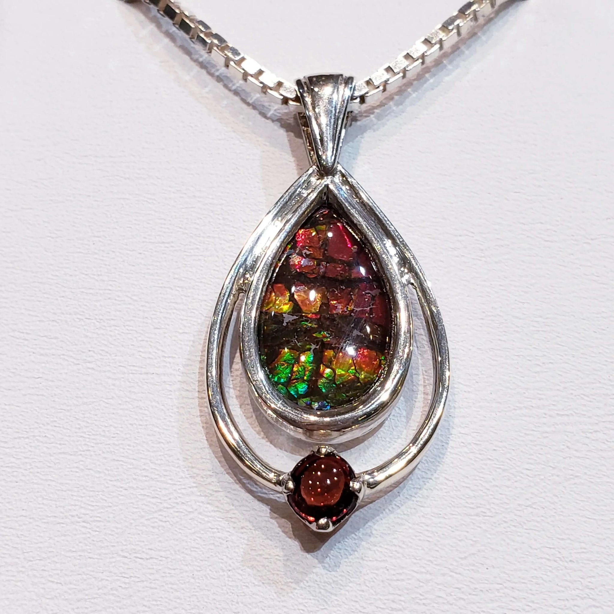 Ammolite Pendant With Garnet 18x11mm In Sterling Silver Pn. E10624 %product from Empire Ammolite